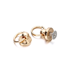 Macro shot of gold ball head studs with O-rings for DIY leathercraft and bag accessories