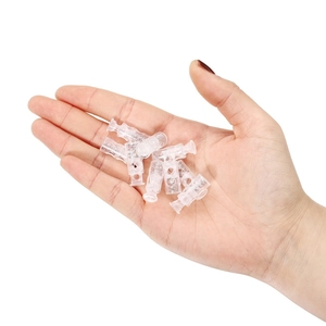 Transparent plastic cord locks with metal springs shown in palm for size reference