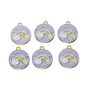 Detail of six purple fruit enamel charms with rainbow cat paws and BE PAWSITIVE text
