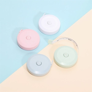 Macro detail of macaron color retractable soft tape measure showing 60 inch scale