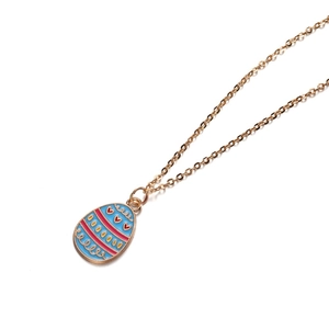 Close-up of Easter egg pendant with blue enamel and pink stripes on gold chain