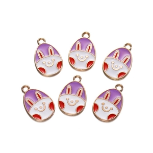 Detail of six purple rabbit enamel charms with gold edges for DIY jewelry making