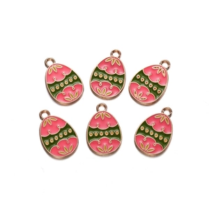 Detail of colorful Easter egg alloy charms with floral patterns for DIY jewelry making