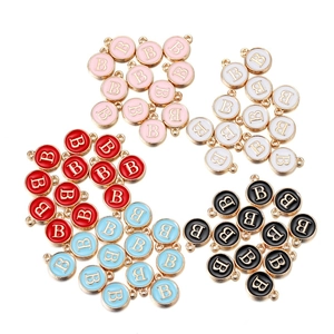 Macro detail of alloy enamel letter B charms in five colors for DIY jewelry making
