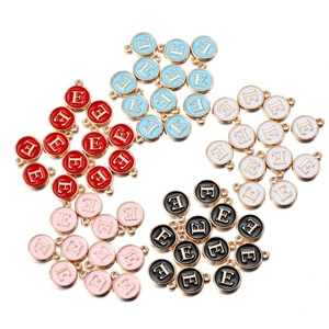 Detailed macro view of colorful enamel letter E alloy pendants for jewelry making