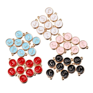 Detail showing colorful enamel alloy initial J pendants for DIY jewelry making and crafts
