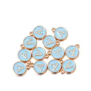 Close-up of light blue enamel round alphabet A charms with gold-plated alloy frames