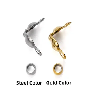 Macro detail of steel and gold jewelry crimp bead covers for necklace making