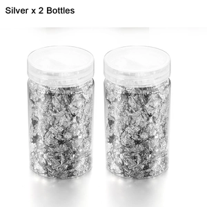 Macro shot of two bottles filled with silver metallic foil flakes for nail art and DIY