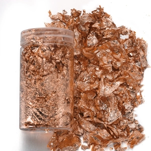 Rose gold metallic foil flakes in a clear jar for nail art and DIY crafts decoration