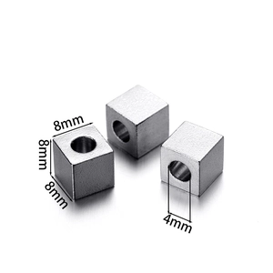 Detailed view of 8mm square stainless steel spacer beads with 4mm hole for DIY jewelry