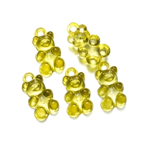 Set of four translucent yellow resin gummy bear charms with hooks for DIY jewelry