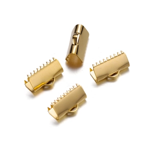 Macro detail of four gold stainless steel crimp ends with teeth for jewelry making