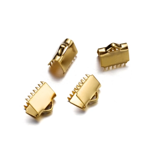 Detailed view of 4 gold stainless steel ribbon crimp ends with serrated teeth and loop