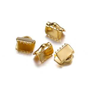 Close-up of golden stainless steel ribbon end crimps with serrated teeth for DIY jewelry