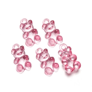 Macro shot of five translucent pink resin bear charms with integrated hanging holes