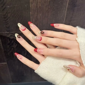 Burgundy enamel press-on nails with luxury gemstones and gold floral embossed art