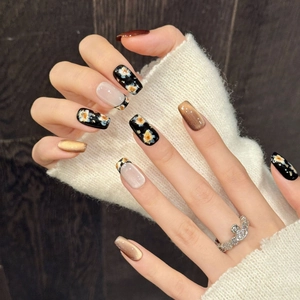 Handmade brown cat eye press-on nails with vintage floral patterns and ballet shape