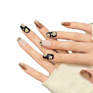 Handmade Maillard floral press-on nails with black gold leaf and brown cat eye effect