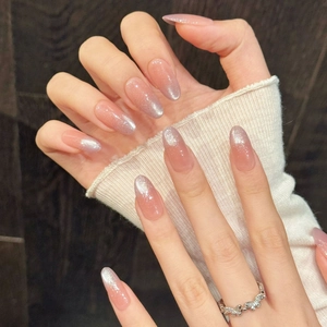 Pink cat eye press-on nails with almond shape and sparkling gradient glitter effect