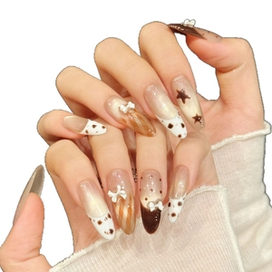 Uñas postizas ojo de gato marrón con estampado de leopardo y lazos blancos en 3D