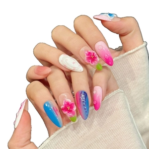 3D embossed floral almond press-on nails with pink peach petals and clear water droplets