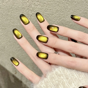 Handmade amber gradient cat eye press-on nails with luxury magnetic shimmer effect