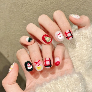 Handmade Christmas bear press-on nails featuring Santa, snowman, and festive red green plaid