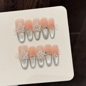 Pink and silver gradient press-on nails with 3D floral, pearl and butterfly accents