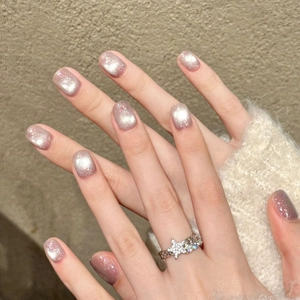 Star-shaped chain ring with sparkling silver zircon stones on a model's hand