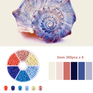 Détail d'un kit de perles de 3mm dans une boîte de rangement ronde à 6 cases