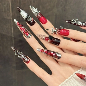 Gothic press-on nails with dark red rose, silver skull, and 3D cross in long stiletto shape