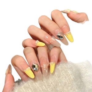 Handmade yellow ombre press-on nails with 3D butterfly, pearls and stiletto shape