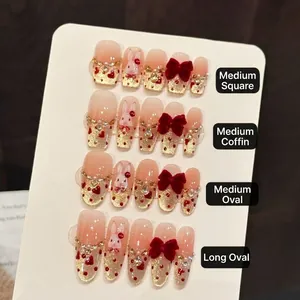 Faux ongles dégradé rose avec nœuds en velours rouge et motif lapin peint à la main