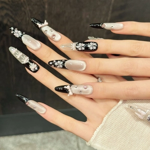 Luxurious almond press-on nails with violet cat-eye effect and 3D bow design