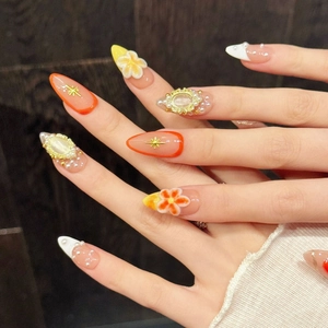 Handmade almond press-on nails with 3D embossed flowers, pearls and golden charms