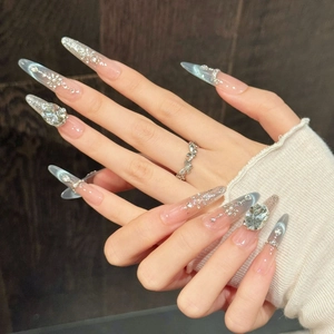 Faux ongles œil de chat bleus avec paillettes et décorations de strass de luxe