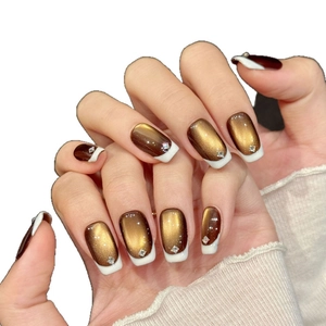Brown gradient cat-eye press-on nails with white French tips and crystal rhinestones