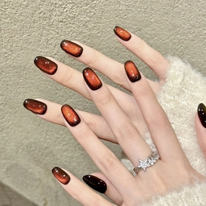 Handmade deep red shimmering cat-eye press-on nails in elegant rectangular shape