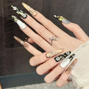 Press-on nails with black cherry blossom art, golden 3D butterflies and cat-eye finish