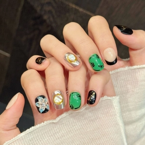 Handcrafted short press-on nails with 3D floral carving and golden foil nail art design