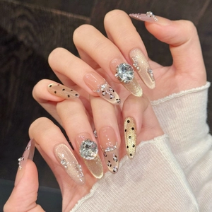 Champagne gold cat eye press-on nails with luxury rhinestones and leopard prints