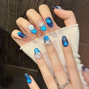 Blue cat-eye press-on nails with 3D starfish and pearl ocean theme design