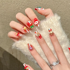 Christmas press-on nails with 3D Santa, gingerbread man and reindeer festive motifs
