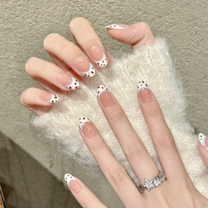 Handmade French nude pink almond press-on nails with blue lines and cow print design