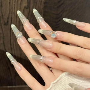 Luxury gold gradient press-on nails with cat-eye effect and rhinestone chain accents
