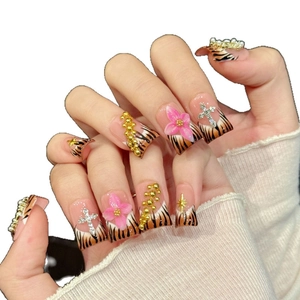 Tiger pattern press-on nails with 3D pink flowers, silver crosses and pearls