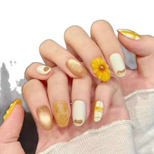 Handmade orange press-on nails with 3D sunflower design and yellow plaid patterns