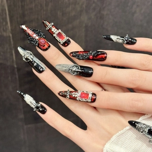 Gothic press-on nails featuring red and black gradient with silver cross and baroque metal accents