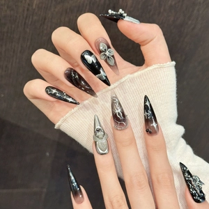 Handmade black silver gothic stiletto nails with skull gems and 3D floral accents
